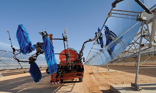 Solar panels being cleaned at the Ain Beni Mathar Integrated Combined Cycle Thermo-Solar Power Plant in Morocco.  World Bank/Dana Smillie