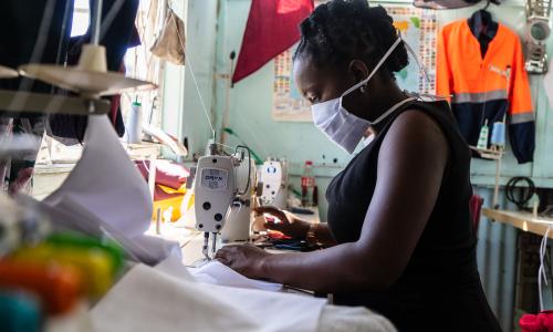 A woman at work at a garment manufacturing factory in Harare, Zimbabwe.