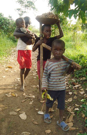 Some of Teddy Nakawoeisi’s grandchildren returning from work on a nearby farm